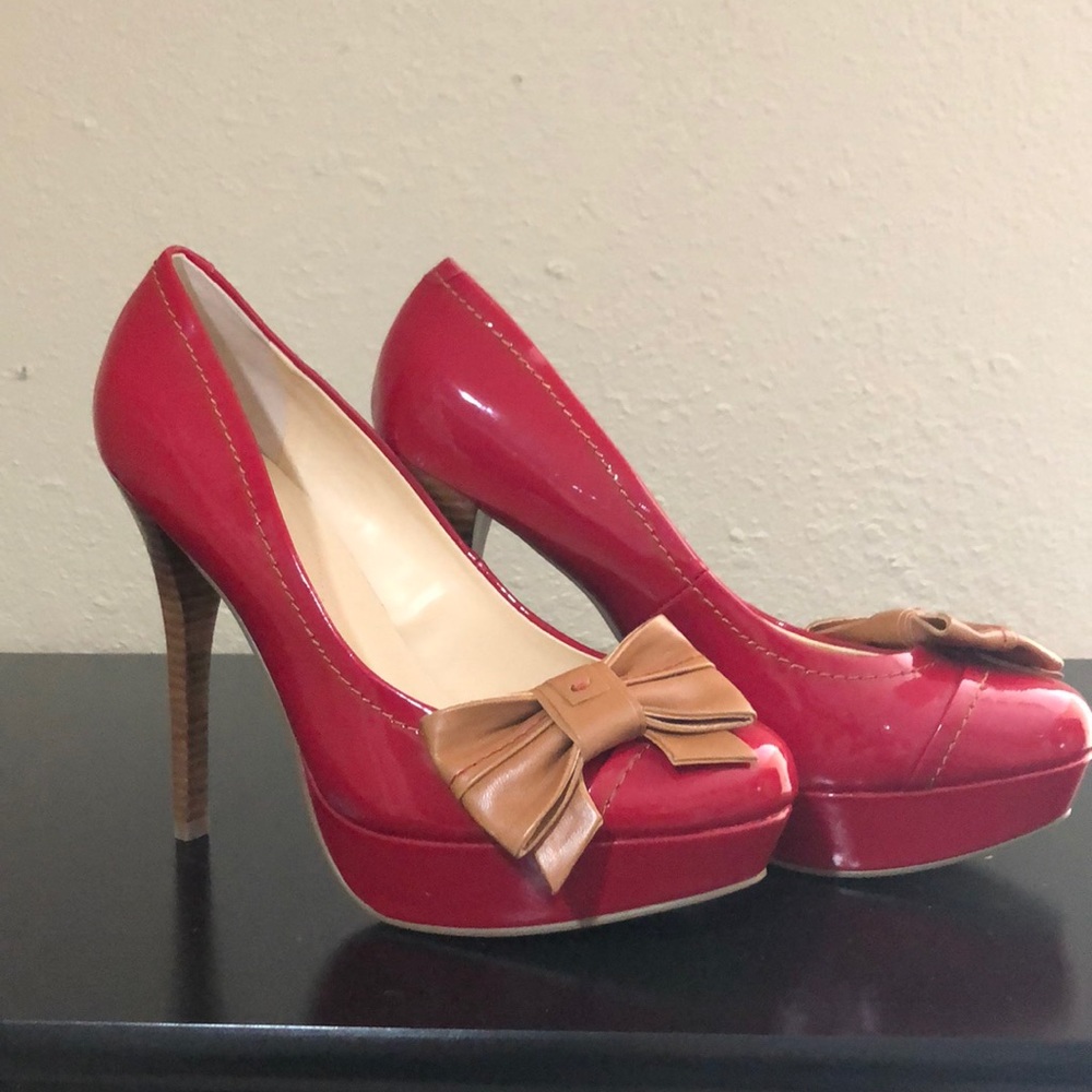 Red platform heels with bow and detail stitching
